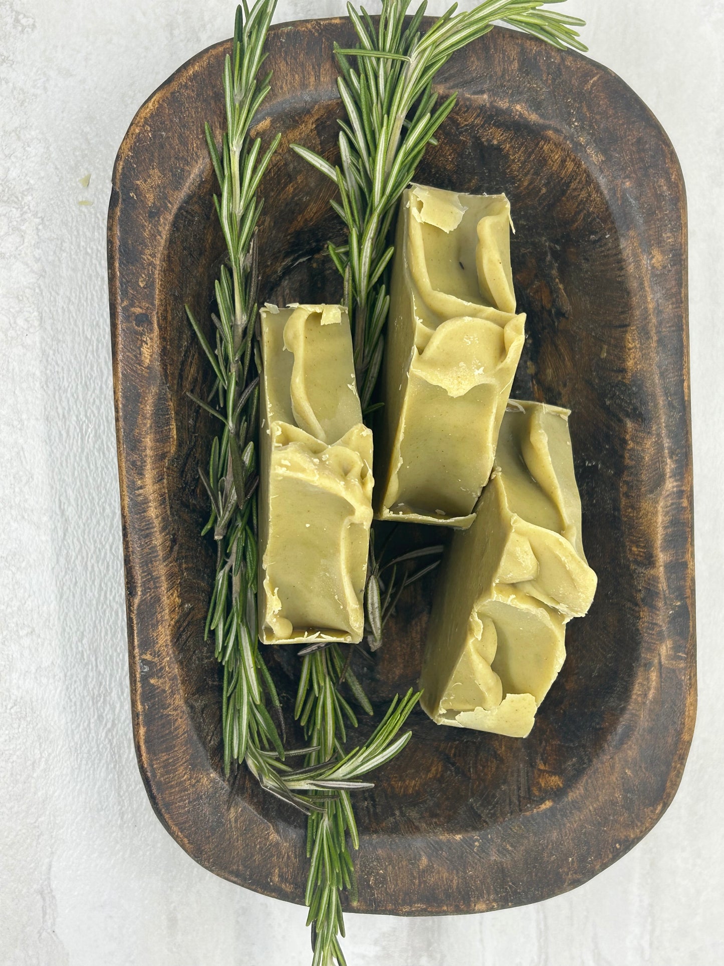 Rosemary & Moringa Spa Soap in a wooden bowl