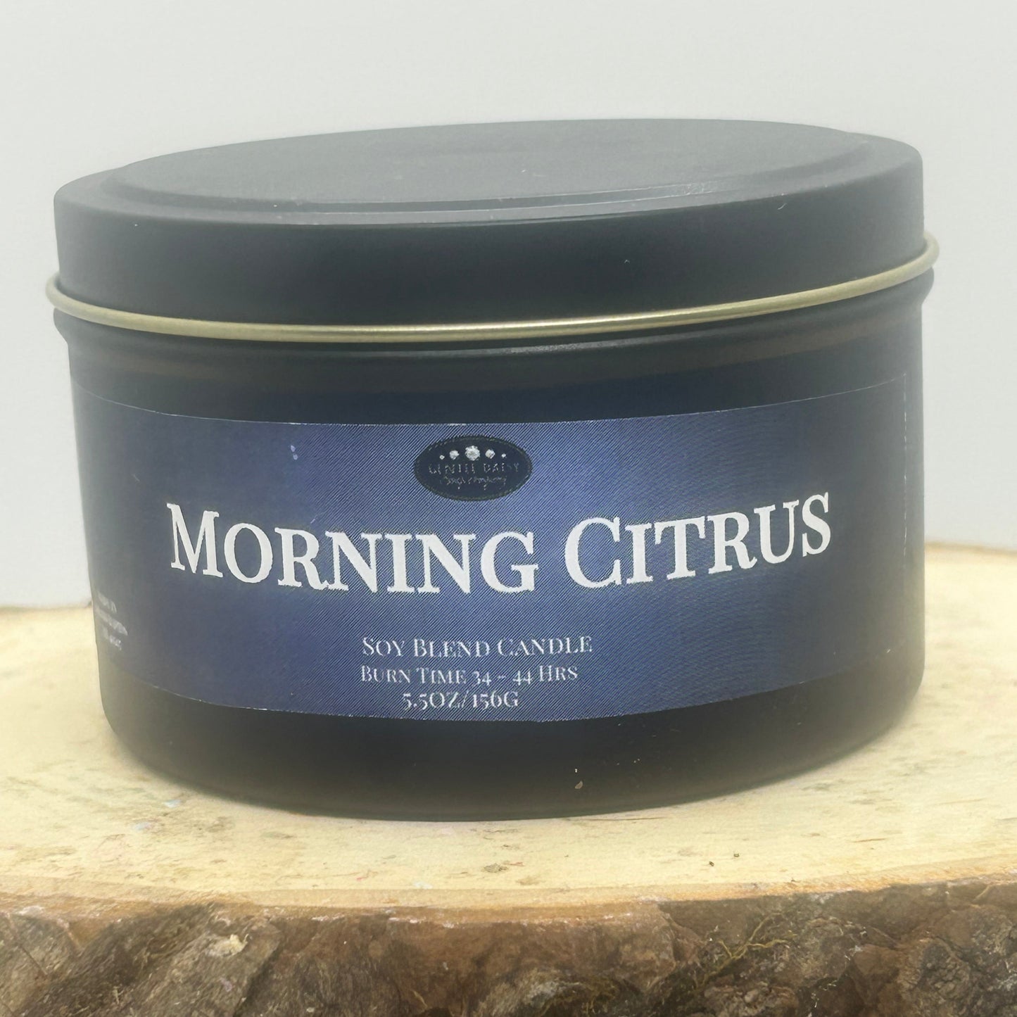 Morning Citrus Soy Blend candle in a black tin