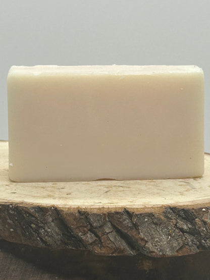 A Bar of 100 percent beef tallow soap on a wood plank