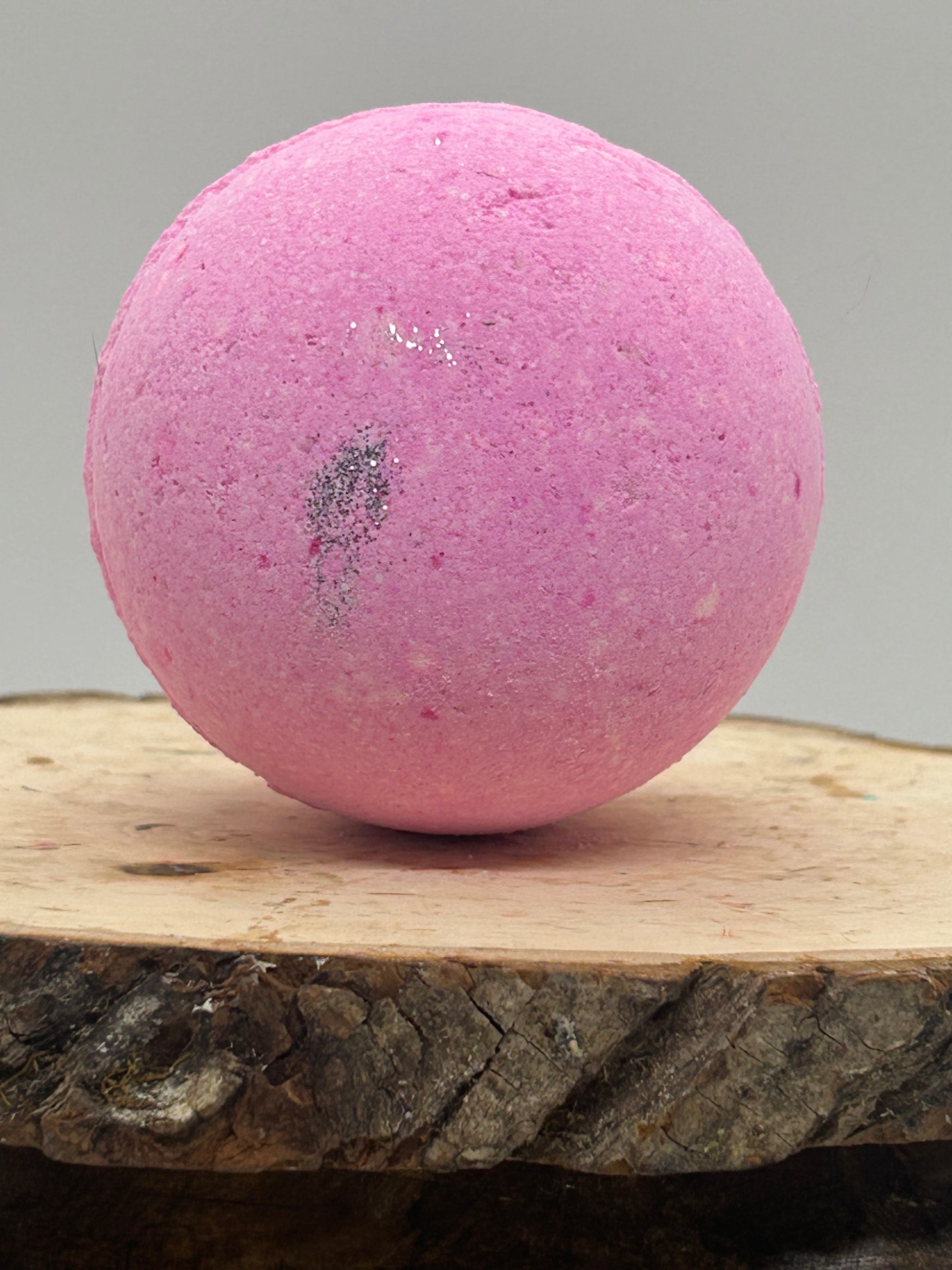 Pink Bath Bomb on wooden Board