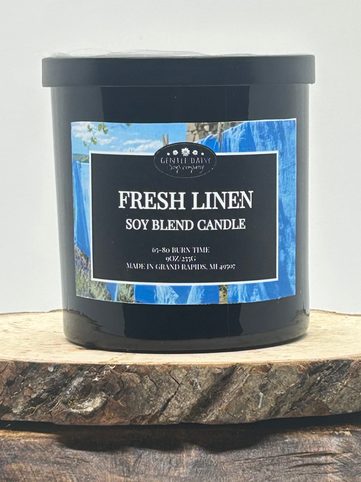 9 oz candle on wood fresh linen scent