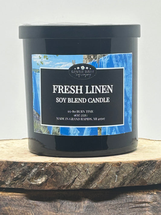 9 oz candle on wood fresh linen scent